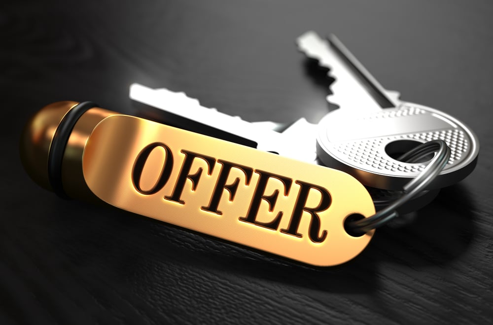 Keys with Word Offer on Golden Label over Black Wooden Background. Closeup View, Selective Focus, 3D Render.-1